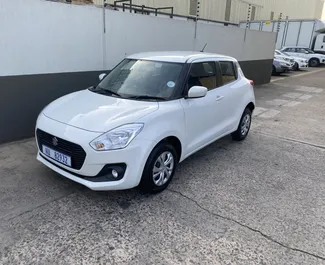 Frontansicht eines Mietwagens Suzuki Swift in Ayia Napa, Zypern ✓ Auto Nr.6465. ✓ Automatisch TM ✓ 0 Bewertungen.