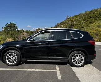 Frontansicht eines Mietwagens BMW X1 in Rafailovici, Montenegro ✓ Auto Nr.7115. ✓ Automatisch TM ✓ 1 Bewertungen.