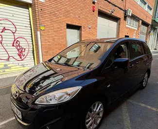 Frontansicht eines Mietwagens Mazda 5 in Barcelona, Spanien ✓ Auto Nr.10932. ✓ Schaltgetriebe TM ✓ 0 Bewertungen.