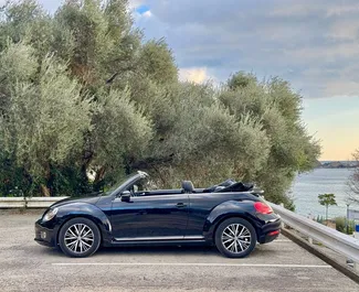 Frontansicht eines Mietwagens Volkswagen Beetle Cabrio in Budva, Montenegro ✓ Auto Nr.13165. ✓ Automatisch TM ✓ 0 Bewertungen.