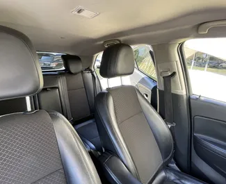 Innenraum von Buick Encore zur Miete in Georgien. Ein großartiges 5-Sitzer Fahrzeug mit Automatisch Getriebe.