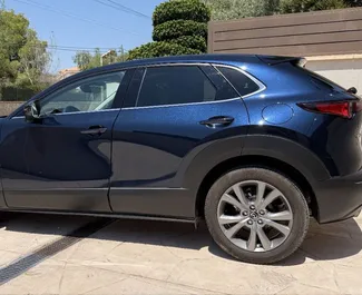 Vermietung Mazda CX-30. Wirtschaft, Komfort, Crossover Fahrzeug zur Miete in Spanien ✓ Kaution Einzahlung von 500 EUR ✓ Versicherungsoptionen KFZ-HV.