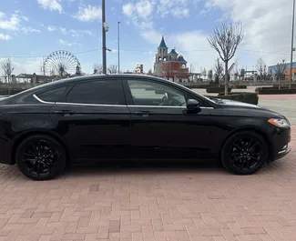 Vermietung Ford Fusion Sedan. Komfort Fahrzeug zur Miete in Armenien ✓ Kaution Einzahlung von 190 USD ✓ Versicherungsoptionen KFZ-HV, TKV, VKV Plus, VKV Komplett, Insassen, Diebstahlschutz, Ausland, Junge, Keine Kaution.