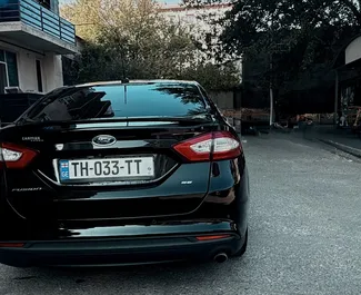 Vermietung Ford Fusion Sedan. Komfort, Premium Fahrzeug zur Miete in Georgien ✓ Kaution Einzahlung von 200 GEL ✓ Versicherungsoptionen KFZ-HV, TKV, VKV Plus, Insassen, Diebstahlschutz, Keine Kaution.