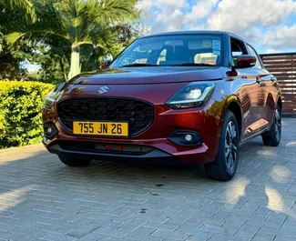 Frontansicht eines Mietwagens Suzuki Swift auf Mauritius, Mauritius ✓ Auto Nr.15654. ✓ Automatisch TM ✓ 0 Bewertungen.